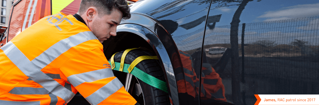 RAC patrol strapping car to a recovery trailer