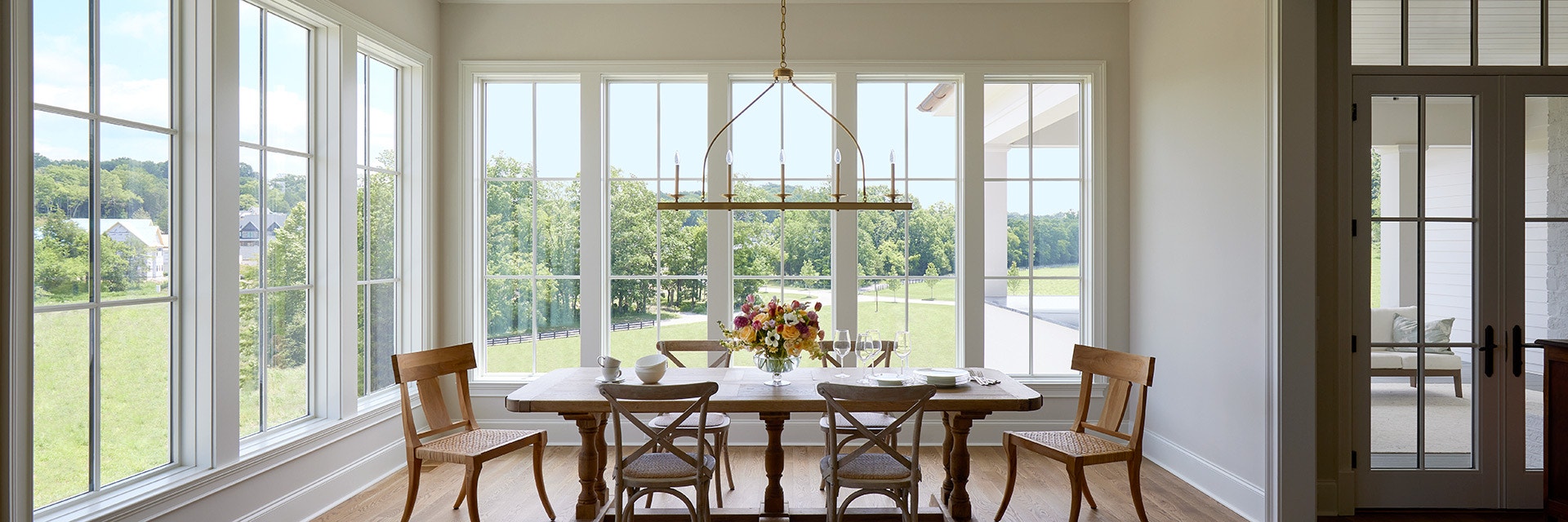 Dining room complete with fixed white windows.